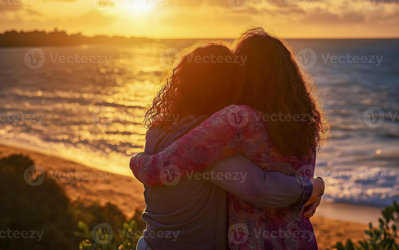 Horizontal Lovely lesbian couple hugging at the beach. photo