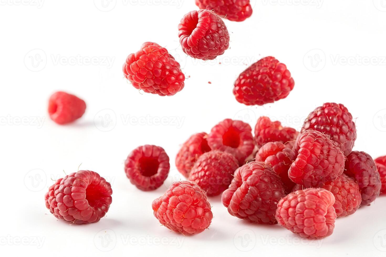 Multiple Raspberries in Motion Isolated on White photo