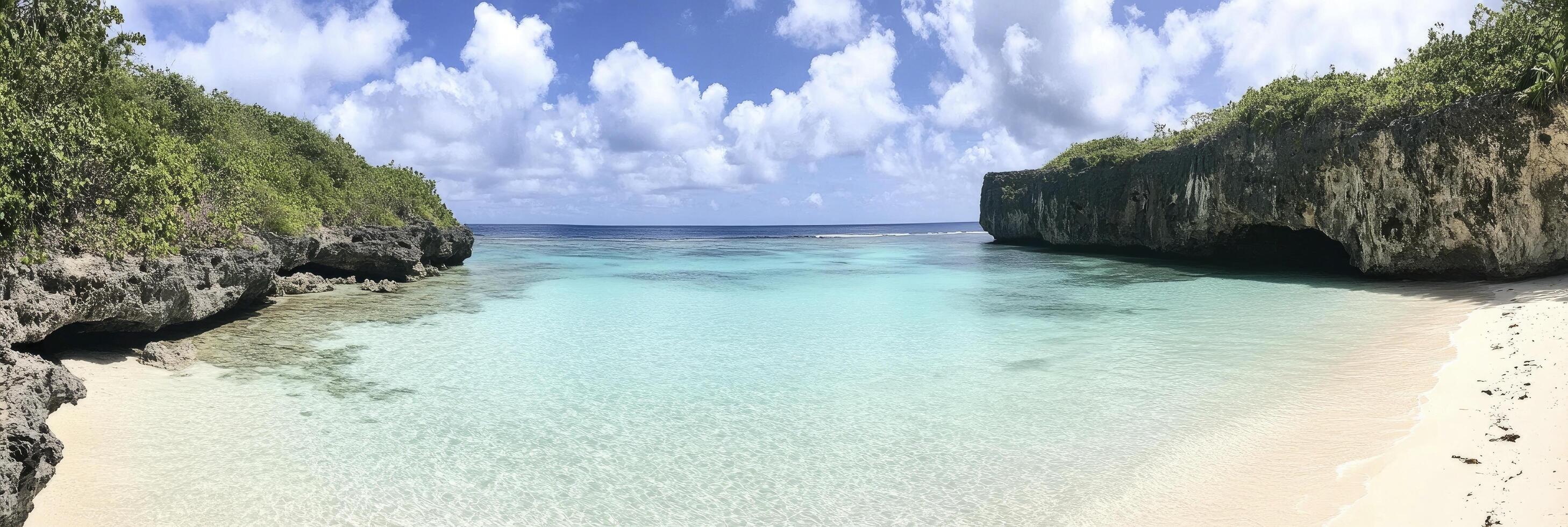 A beach with clear water and a cliff photo