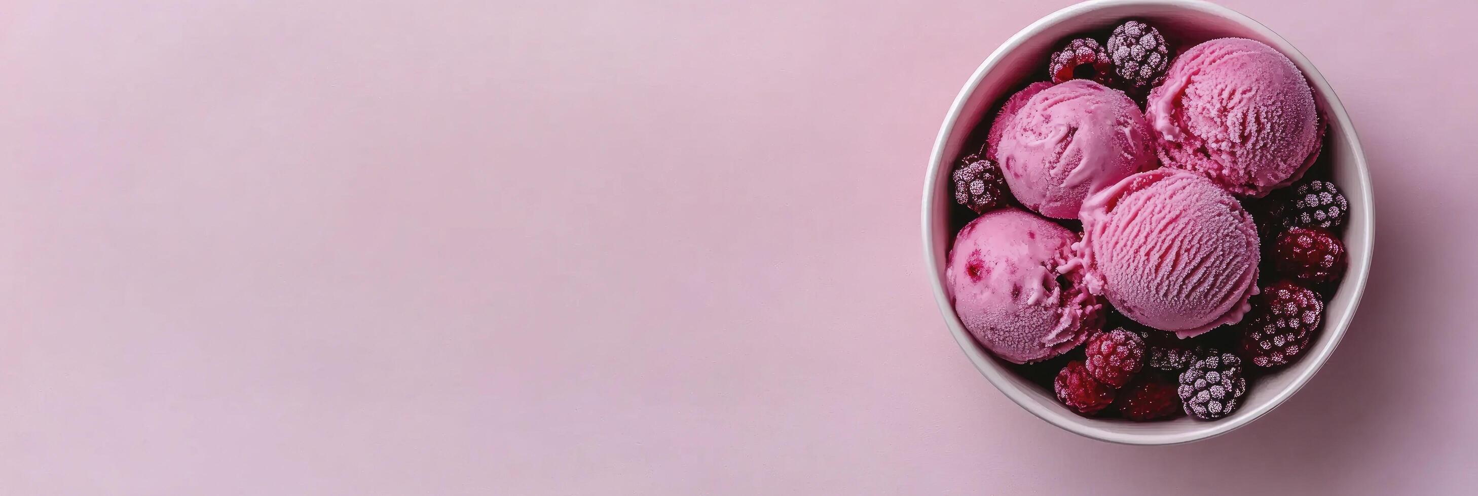 A bowl of ice cream with berries and raspberries photo