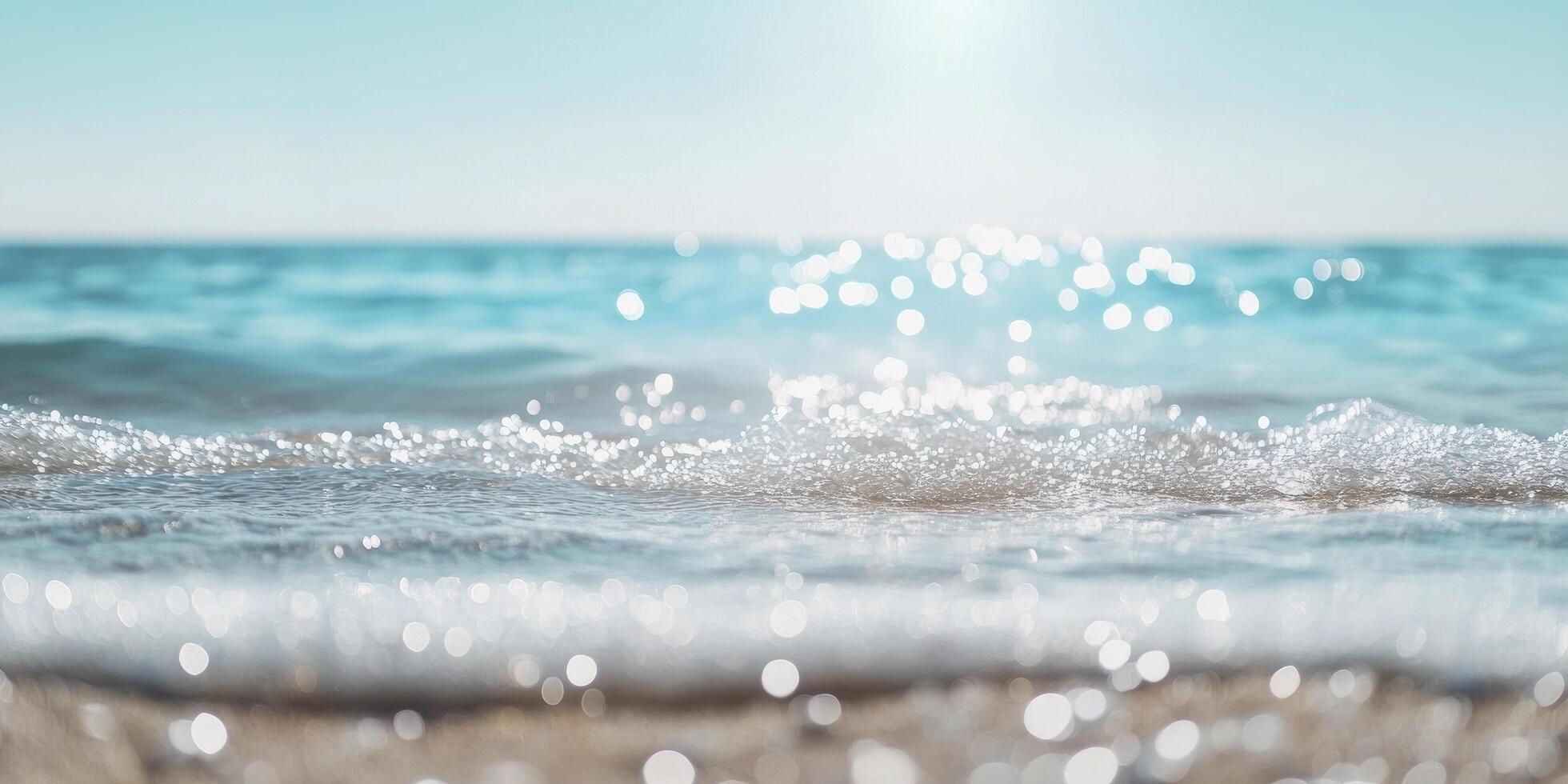 Sea waves on the beach with sun shining through photo