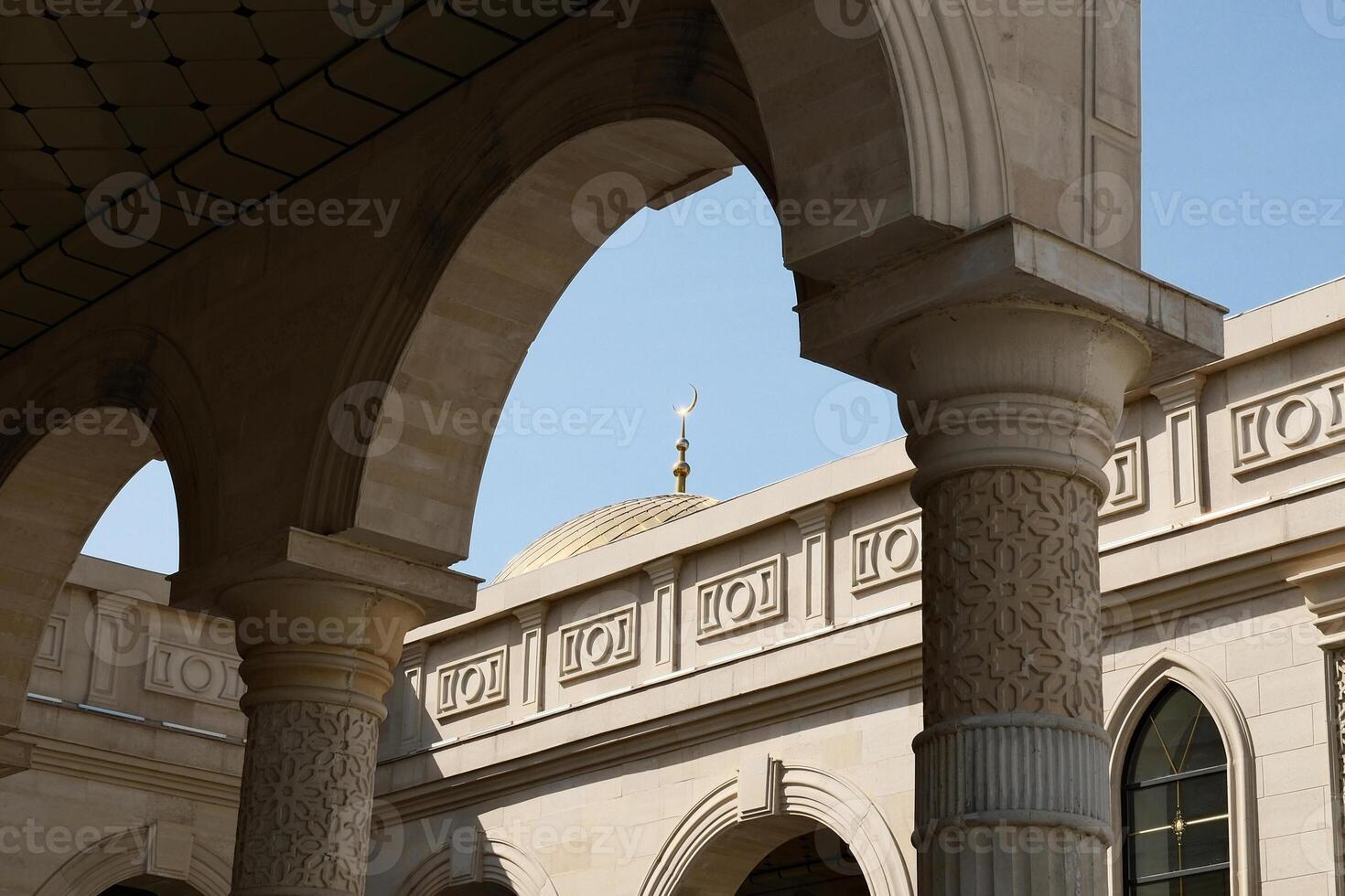 Architectural details of an Islamic building with arches and columns photo