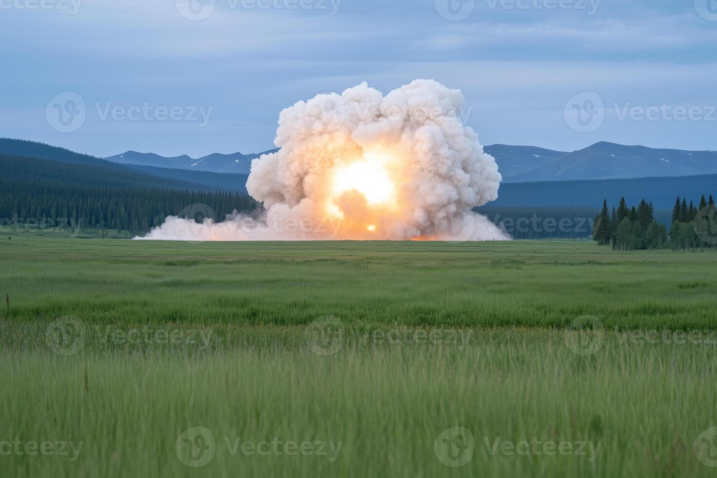 explosion in the steppe with a mountain range in the background photo