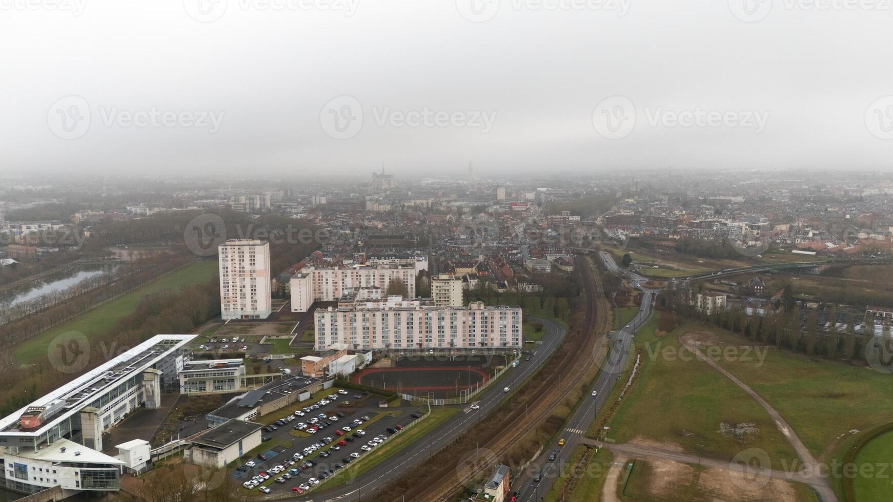 View of Amiens, France with Residential Buildings, Railway, and Green Spaces photo
