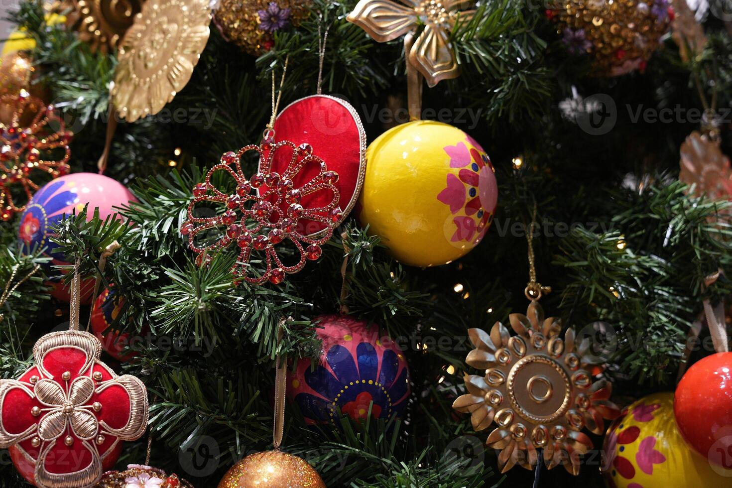 Christmas tree adorned with colorful handcrafted ornaments and sparkling lights photo