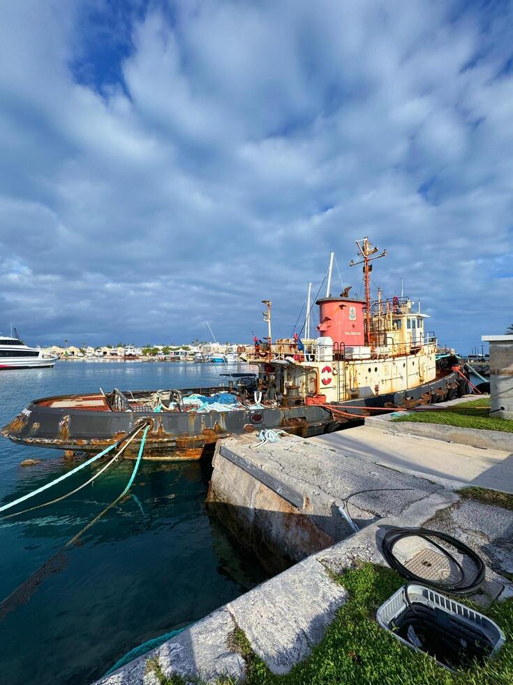 Atlantic Ocean, Bermuda 10. 22. 2023 Rusty Tugboat Docked. Morning Light photo