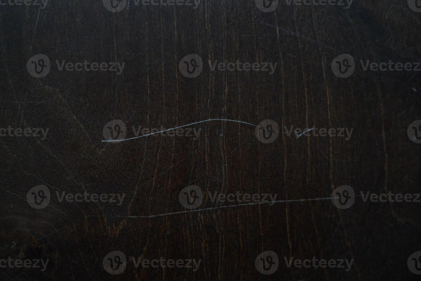 Wooden background with scratch texture on the surface. The background is in the grunge style. An overlay for your design with the ability to copy. photo