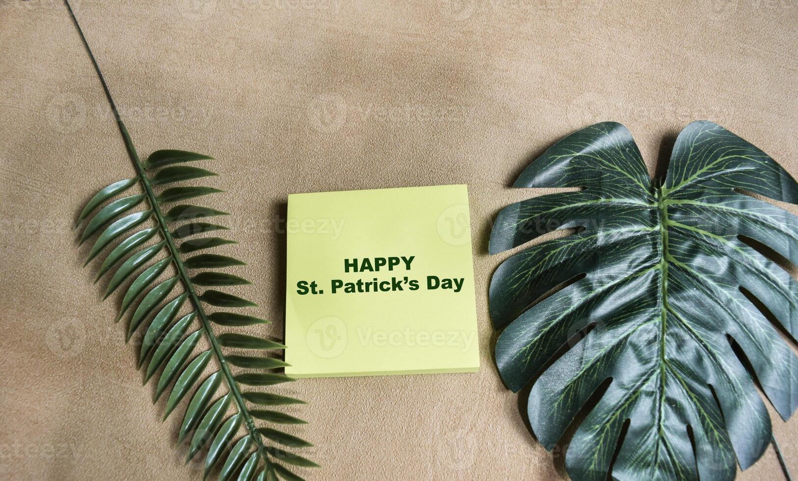Concept of Happy St. Patrick's Day write on sticky notes isolated on Wooden Table. photo
