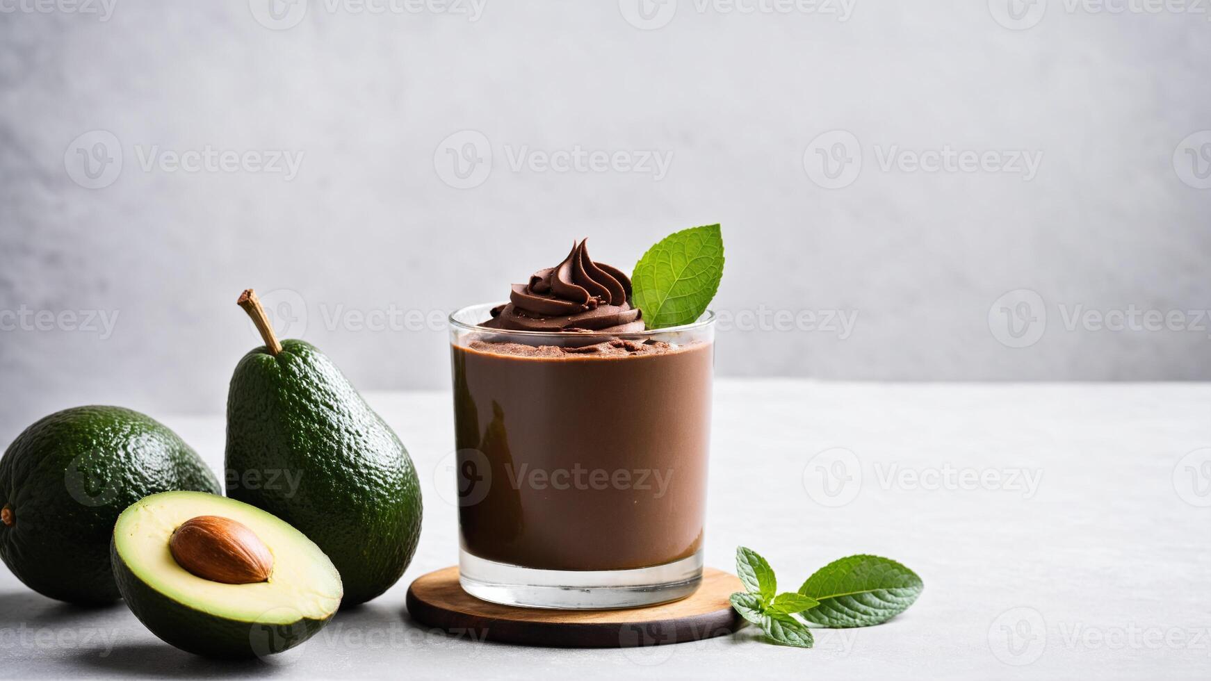 Avocado smoothie with chocolate and mint leaves photo