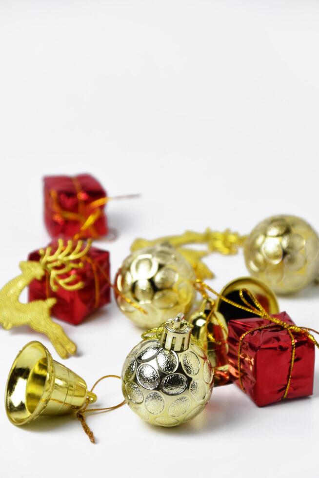 Festive collection of gold baubles and red holiday boxes photo