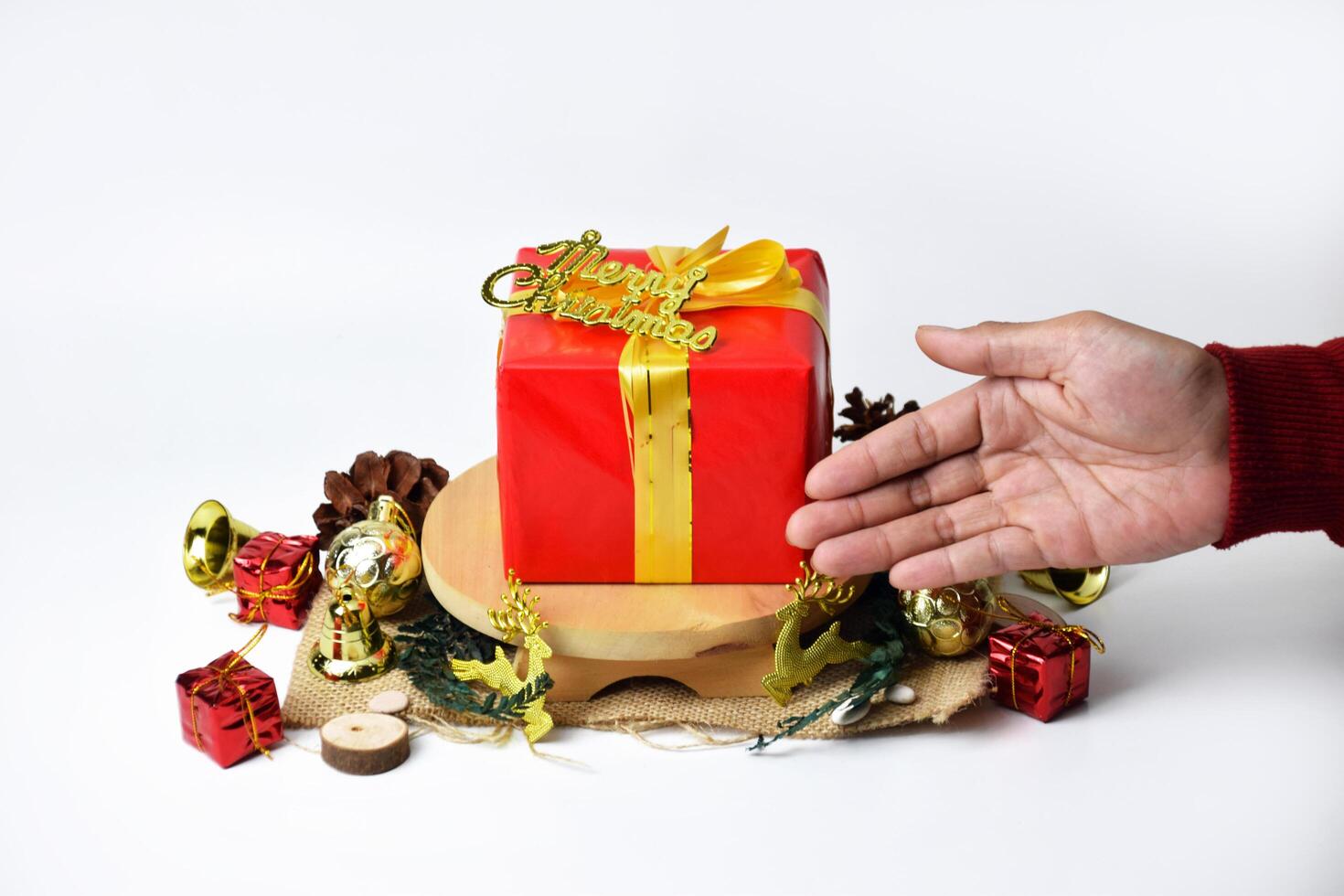 Red Holiday Present Box with Gold Bow and Merry Christmas Text photo