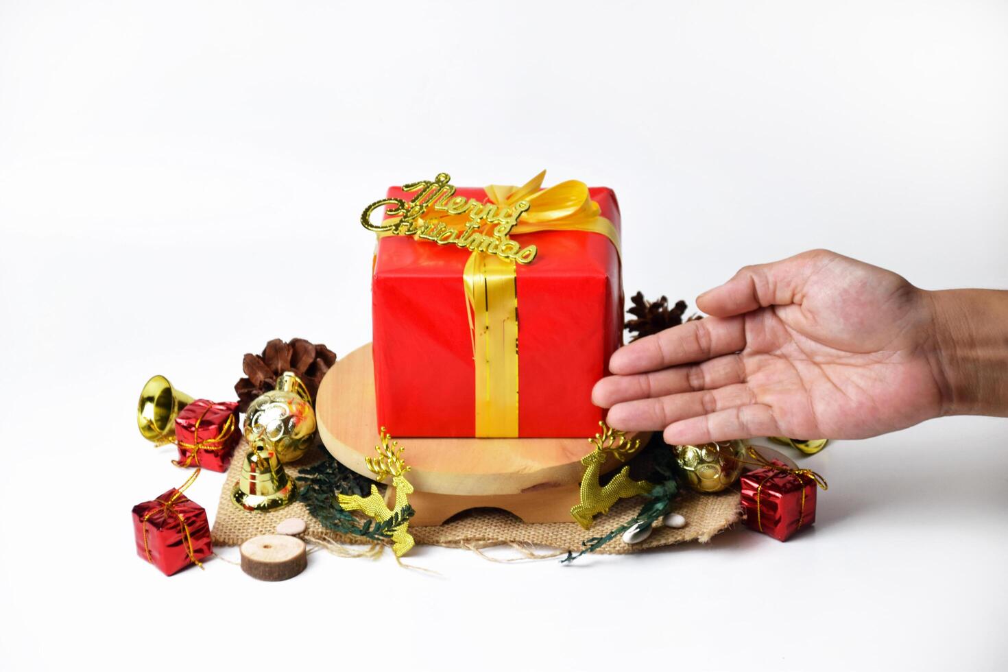 Red Holiday Gift Box with Gold Bow and Merry Christmas Message photo