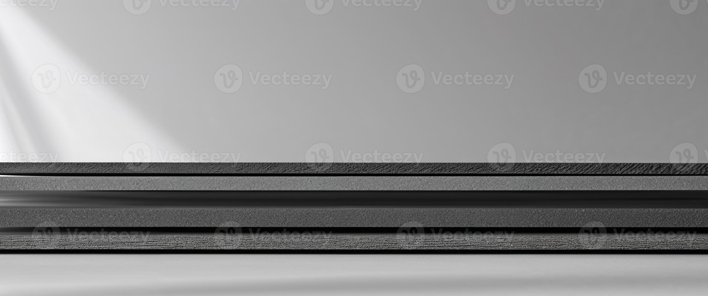Horizontal layers of textured dark gray material create depth. photo