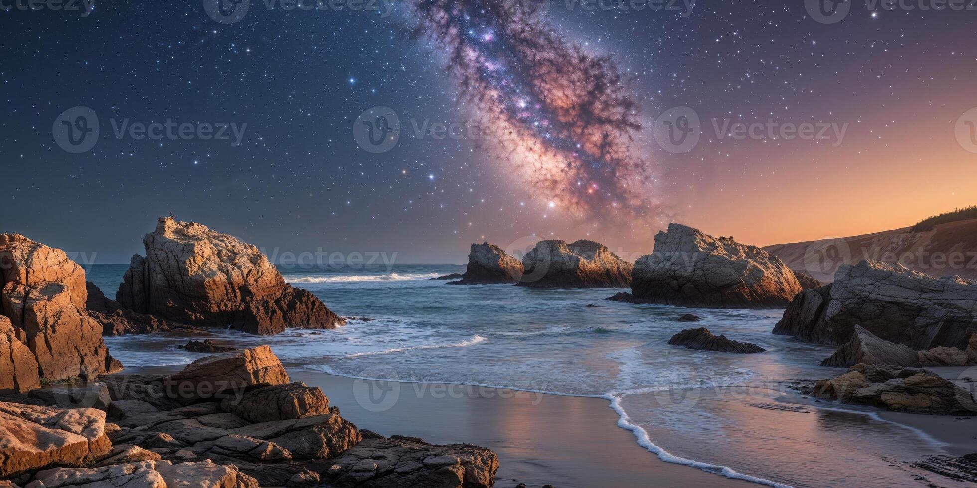 The milky way over the ocean in the night sky photo