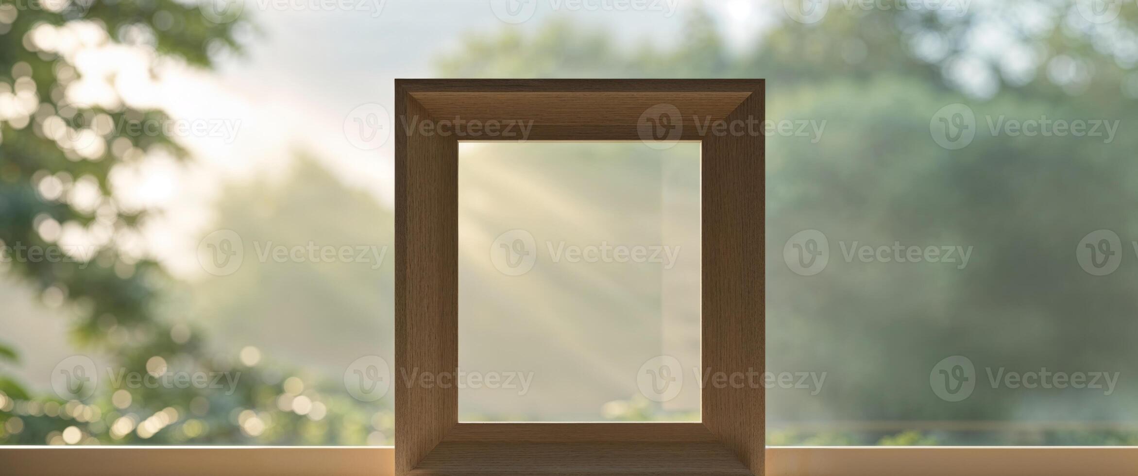 Mockup of a wooden frame standing on a windowsill. photo