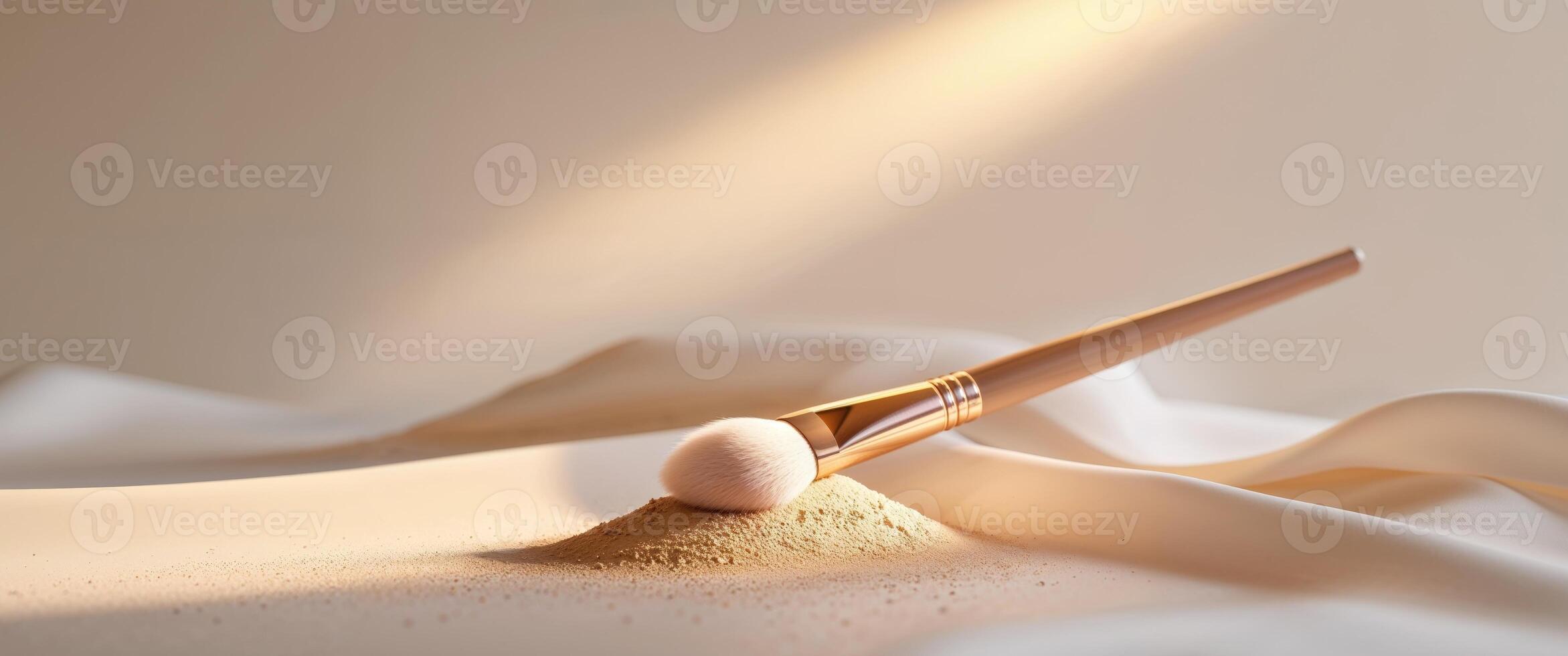 A makeup brush and powder on a white cloth photo