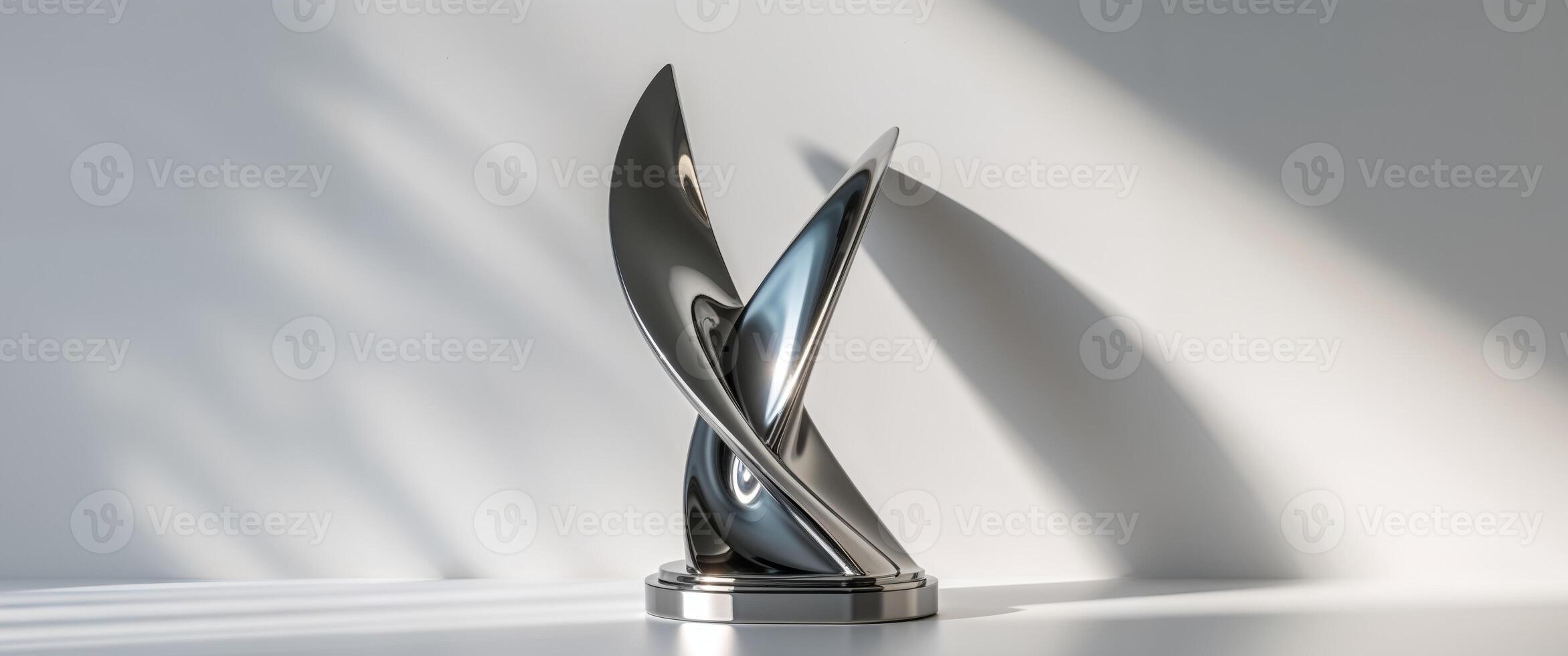 An asymmetrical titanium trophy featuring a sleek reflective twist design. photo