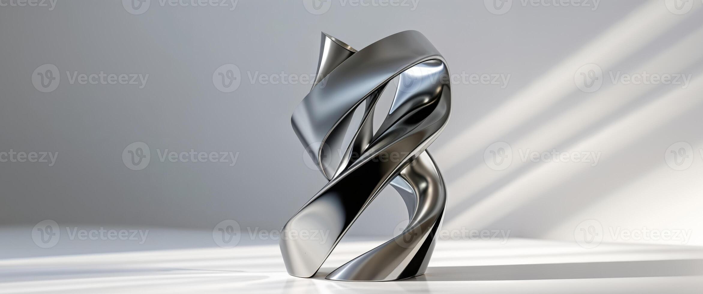 An asymmetrical titanium trophy featuring a sleek reflective twist design photo
