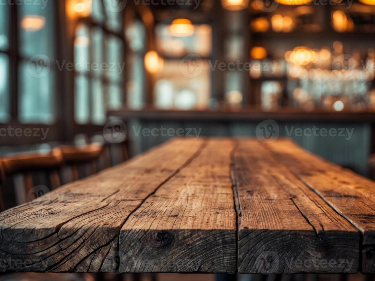 Rustic wooden table in a dimly lit bar setting photo