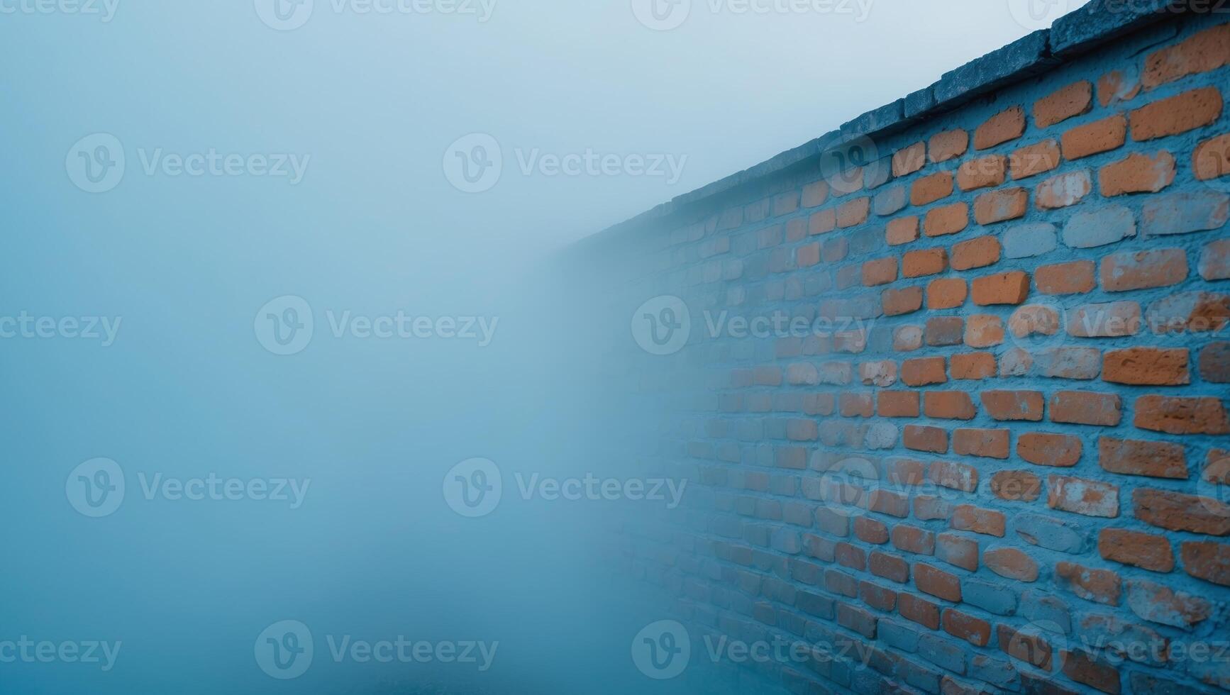 Brick wall with a blue background and a foggy mist photo