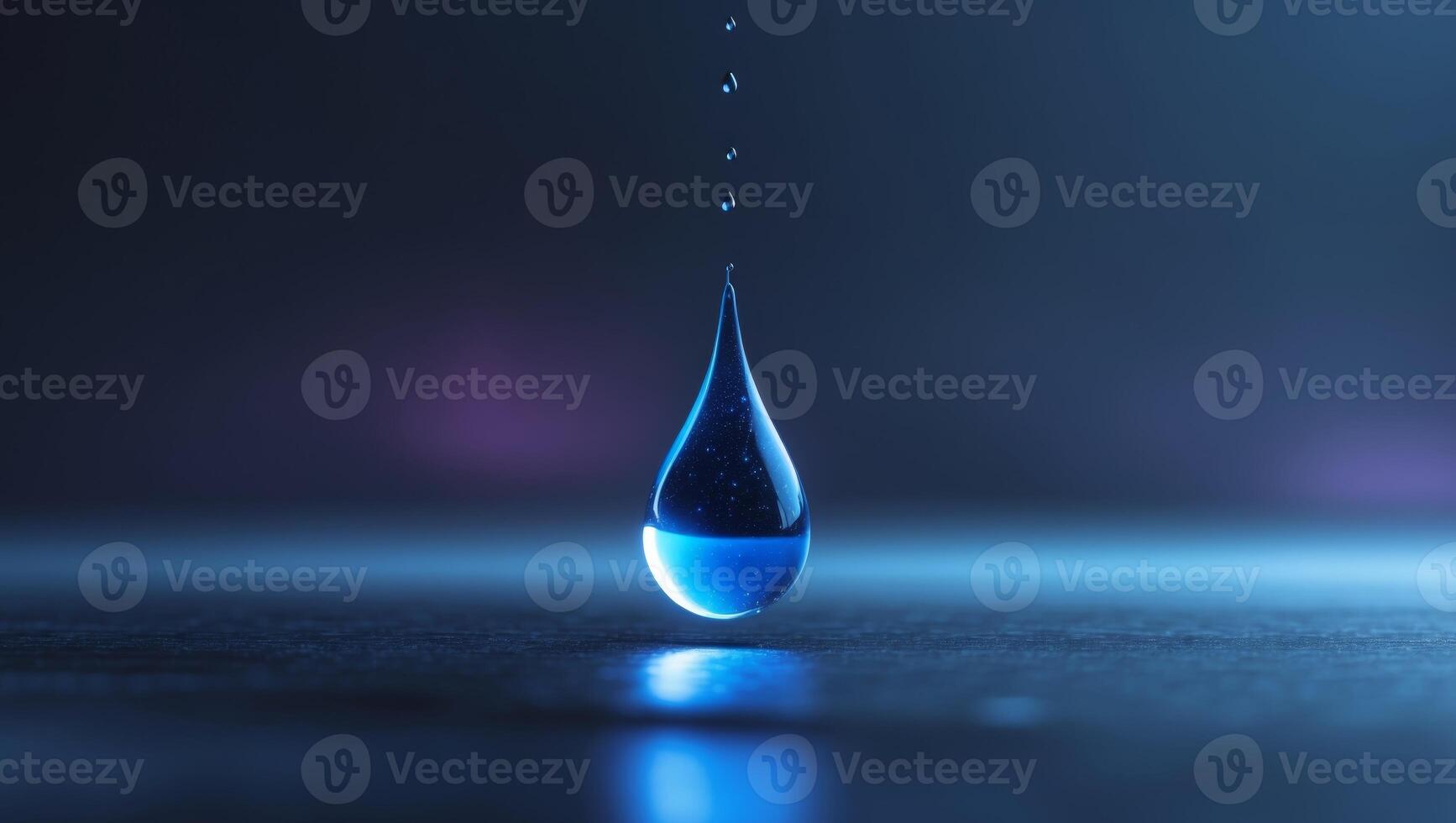 A drop of water falling from a blue light photo
