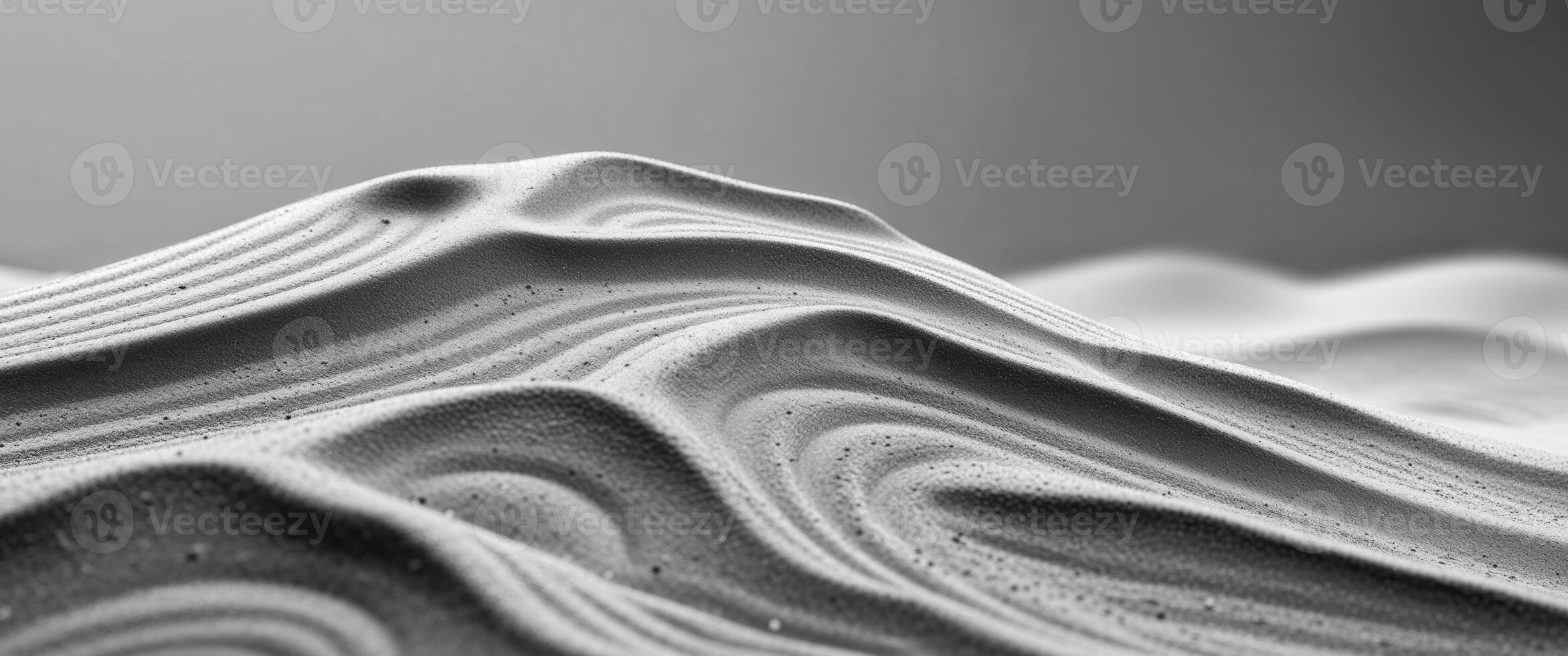 Delicate sand pile with natural ripples creating serene texture. photo