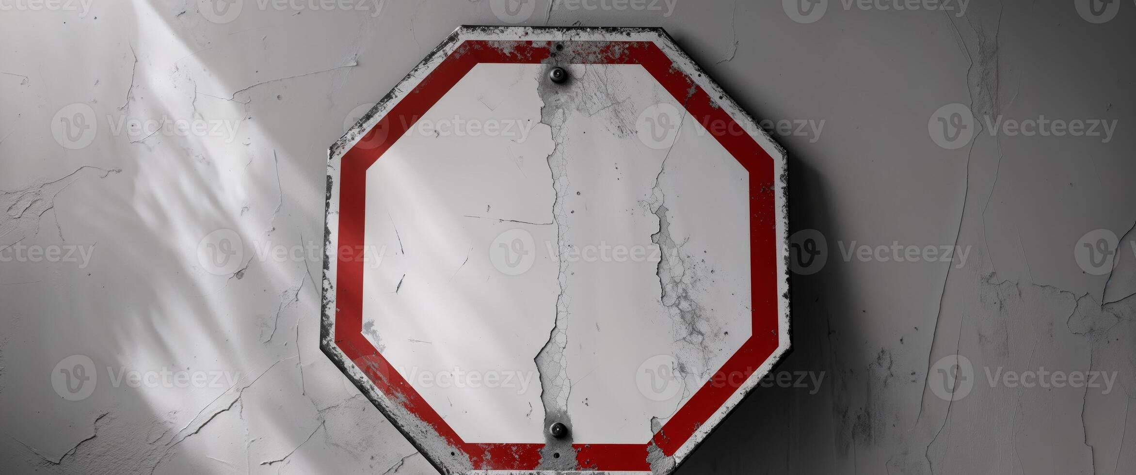 Weathered Octagonal Stop Sign with Blank Center and Faded Red Border. photo