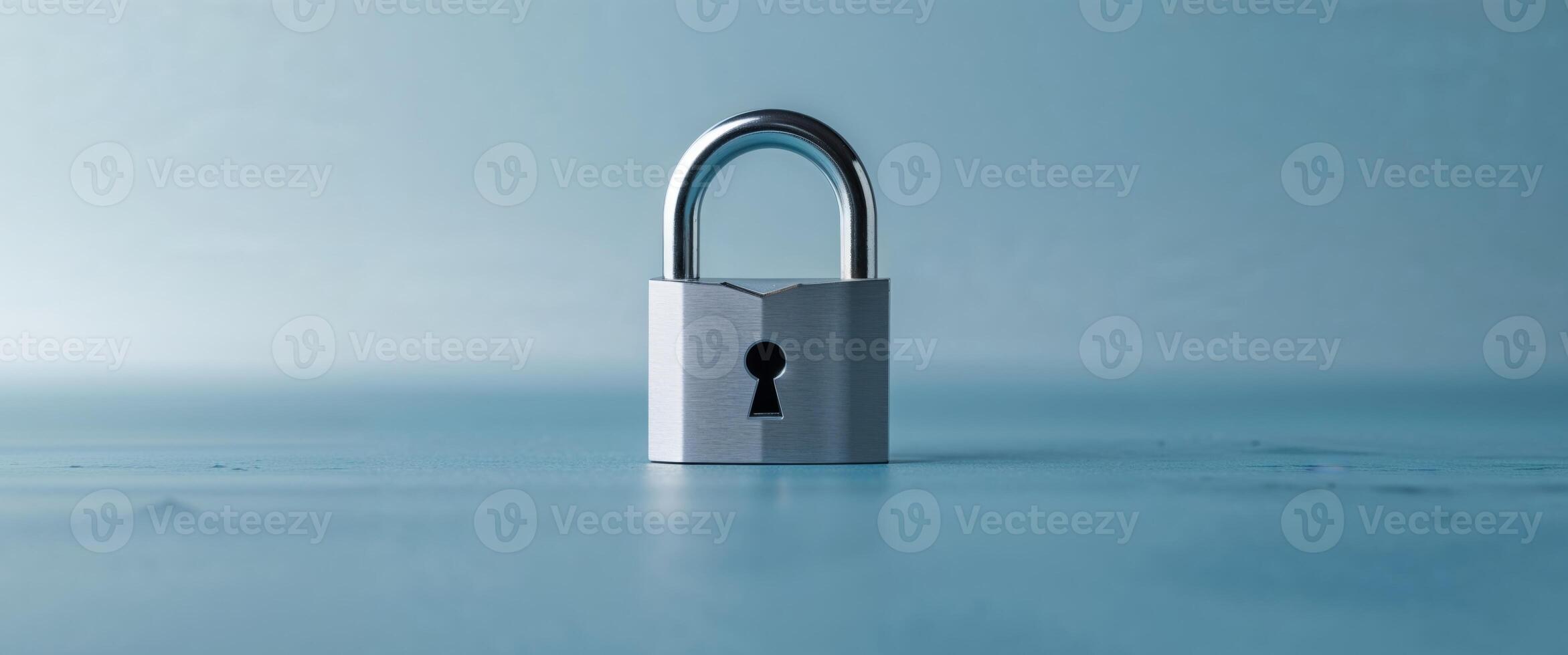 A silver lock with a keyhole on a blue background photo