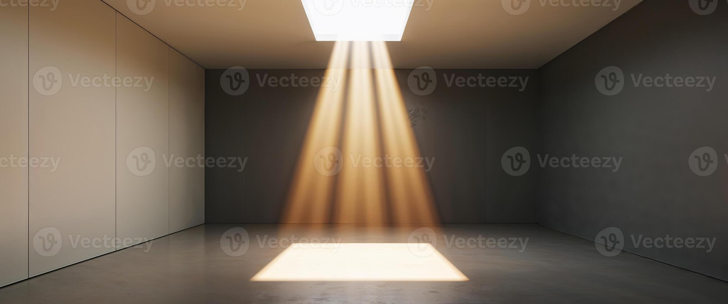 Illuminated room with sunlight streaming through ceiling in a dark space. photo
