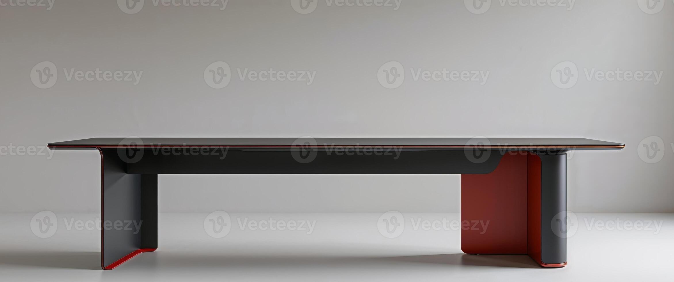 Sleek modern desk with dark top and reddish accents photo
