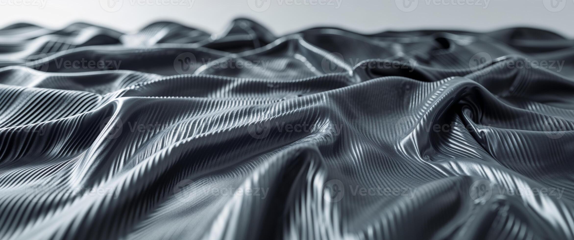 A close up of a black fabric with some waves photo