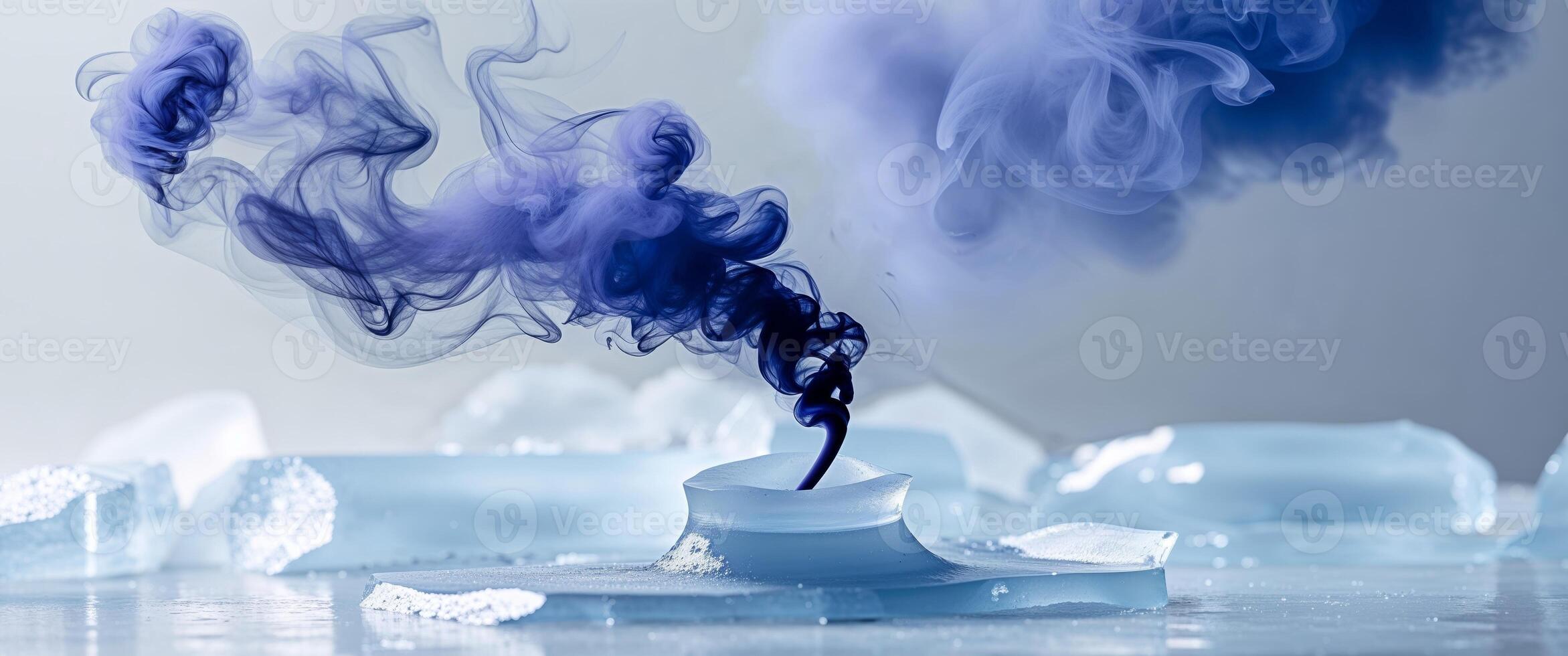 Blue smoke is being poured into a glass photo