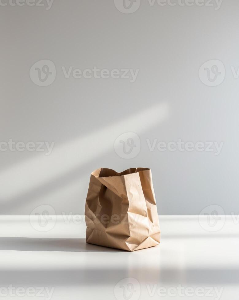 Empty Brown Paper Bag on a White Surface photo