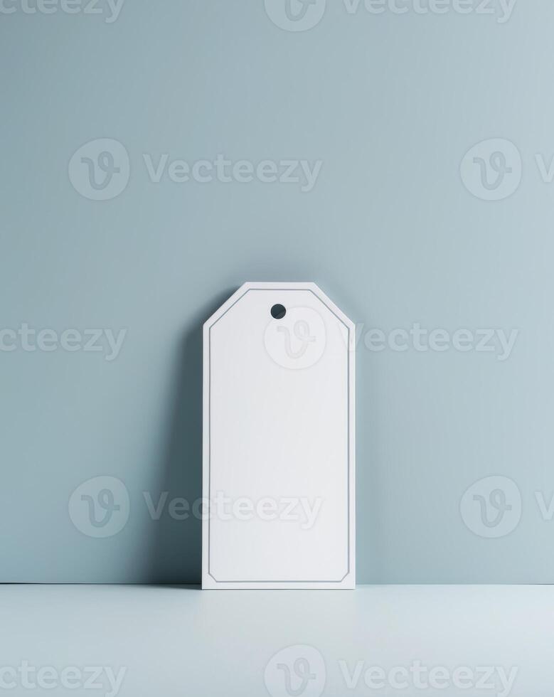 Blank white tag on blue background photo