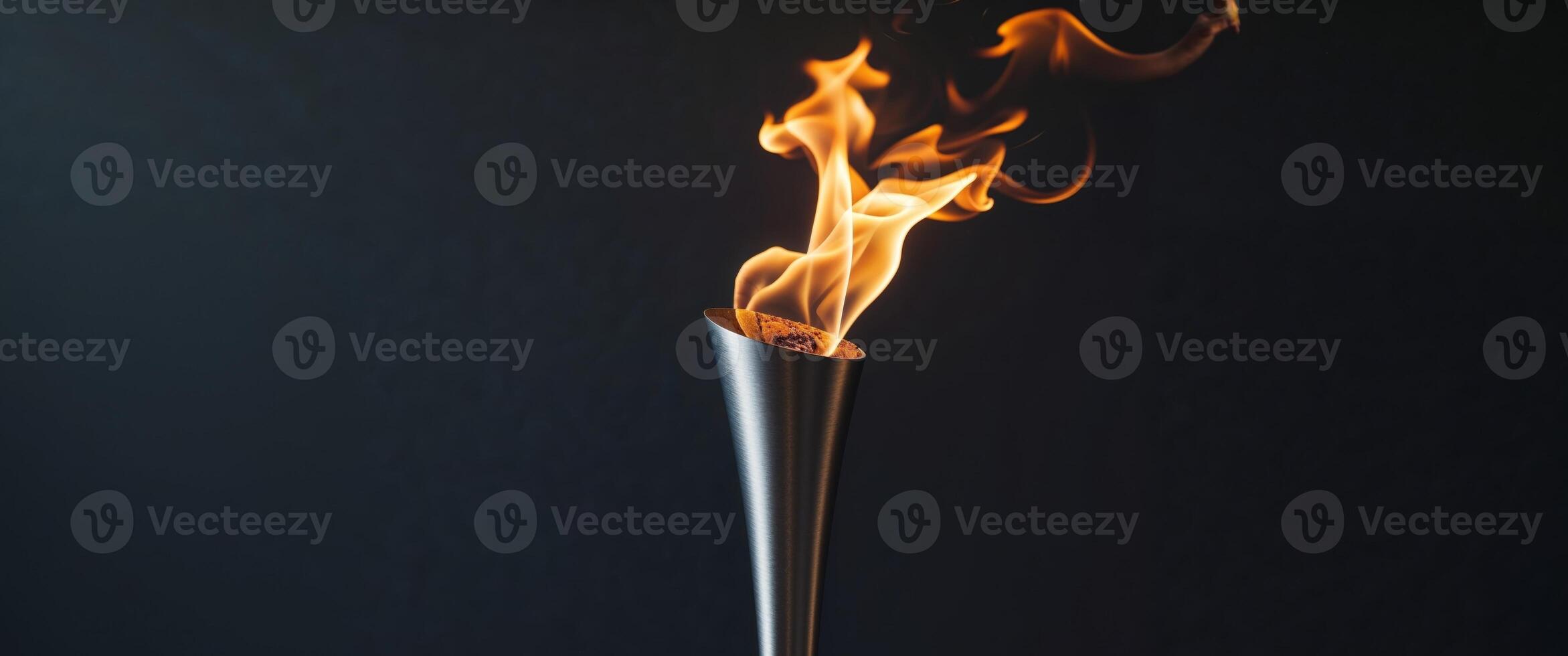 Beautiful torch with burning fire on black background. photo
