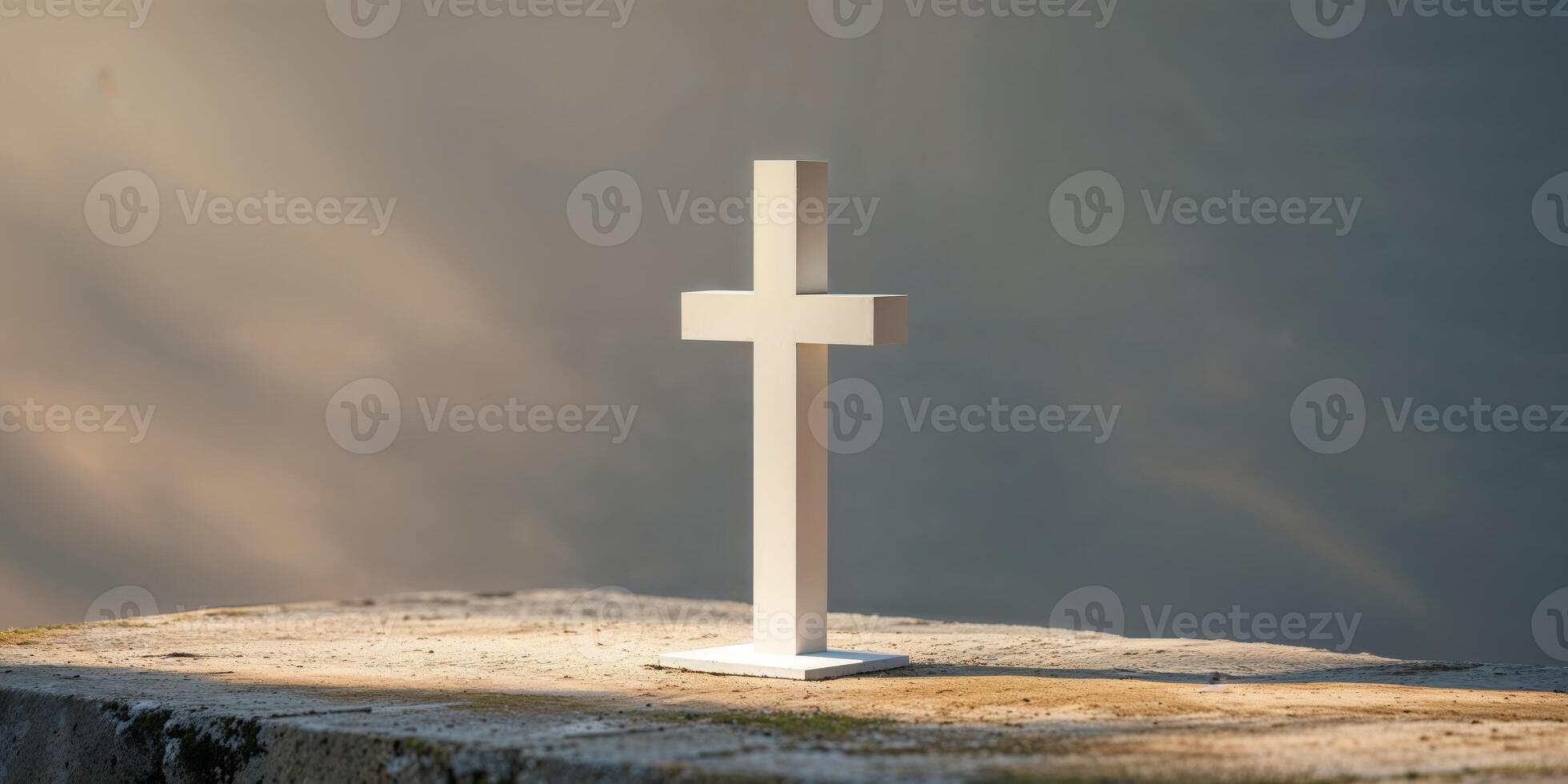 White cross on stone base illuminated by soft sunlight and shadows. photo