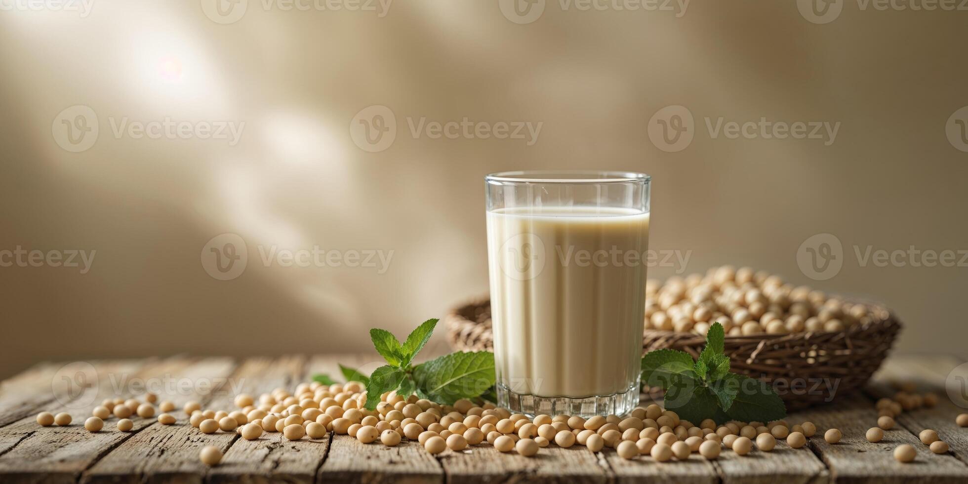 Soy milk in a glass on a wooden table photo