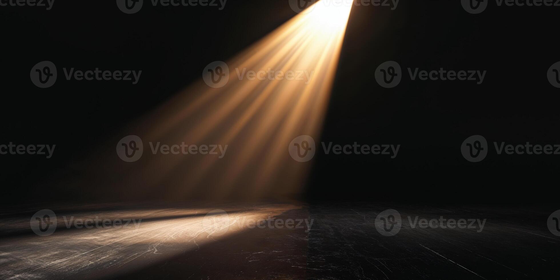 A spotlight shines on a dark floor photo