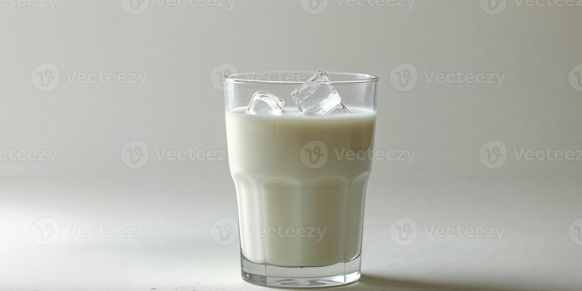 A glass of milk with ice on top photo