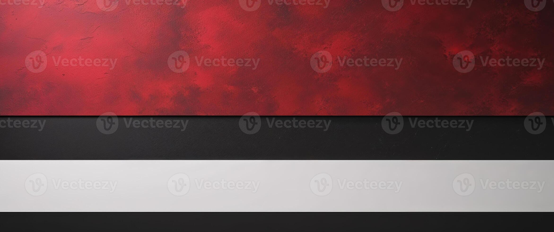 A tight shot of a red and black background featuring a white and black horizontal band at the picture's base photo