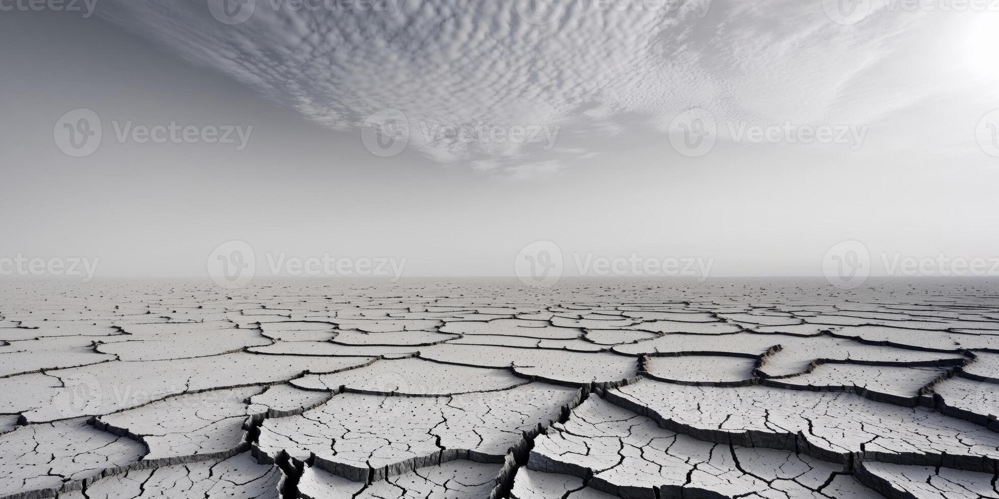 Barren Cracked Dry Earth with Bright Overcast Sky Symbolizing Drought and Climate Change Impact. photo
