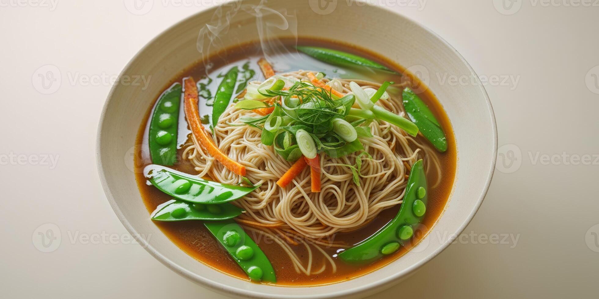 Delicious Bowl of Noodles with Fresh Vegetables and Savory Broth Served photo