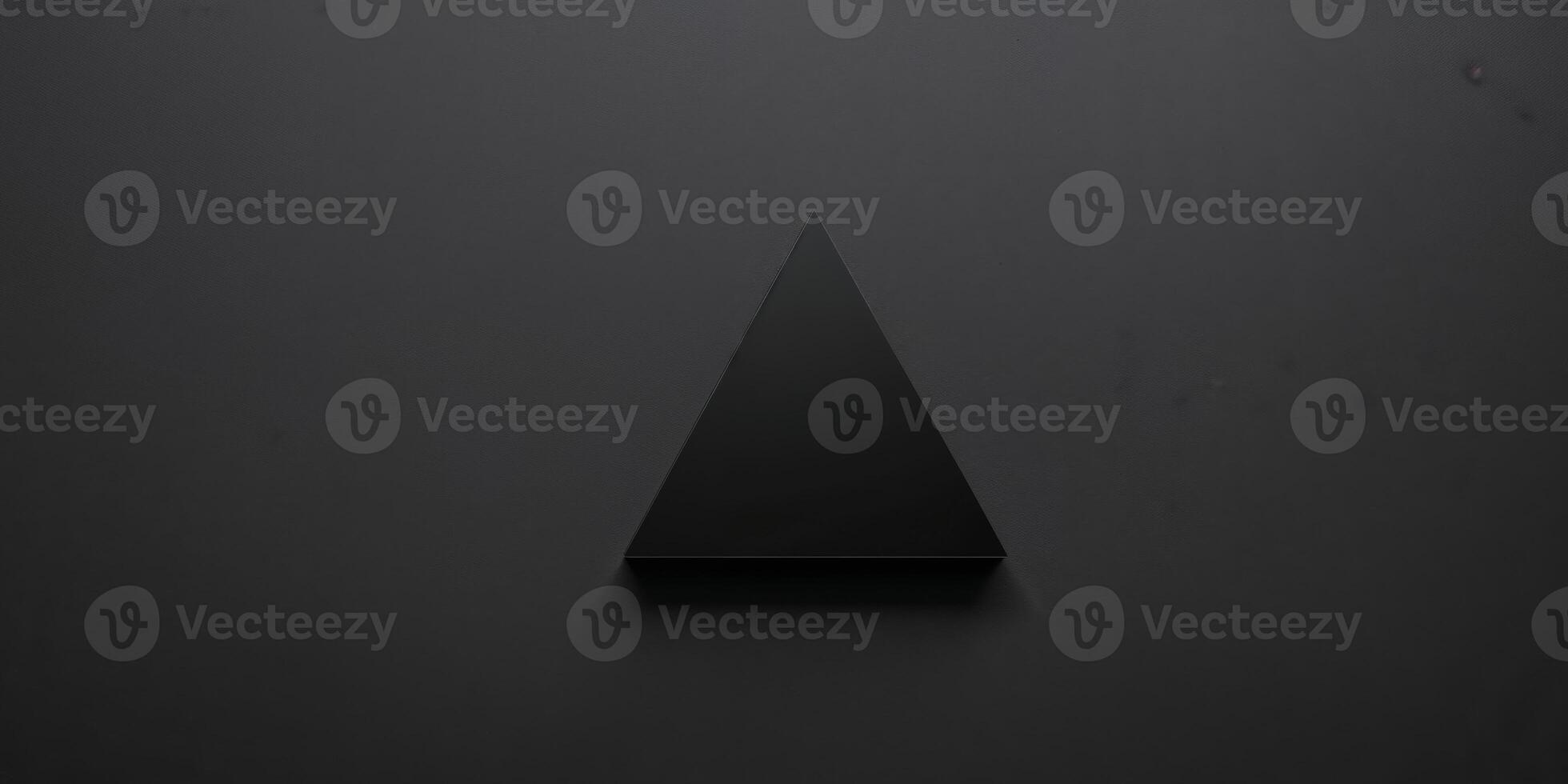 A black background with a black triangle on it. photo