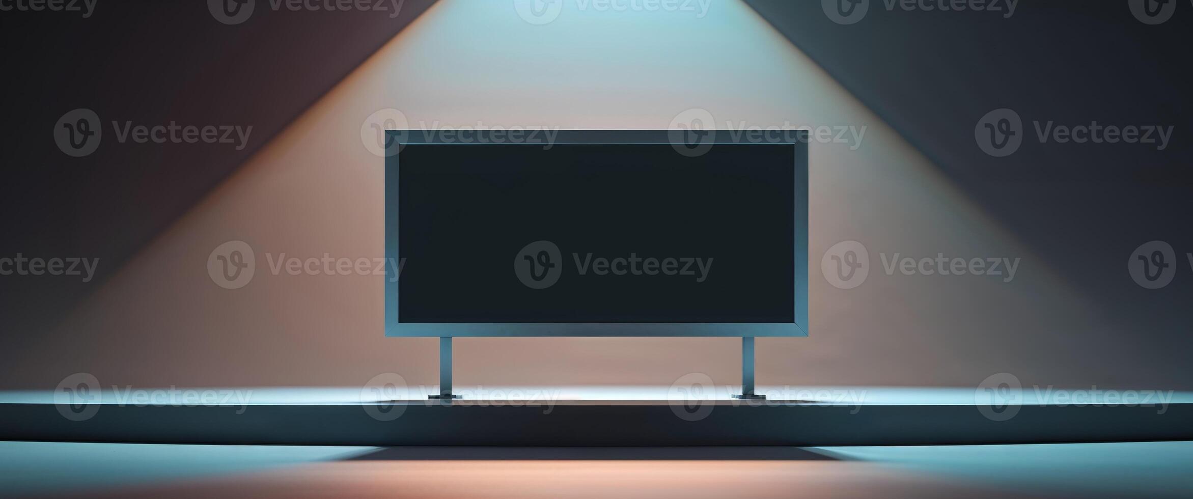 An empty black billboard on a stage with spotlight photo
