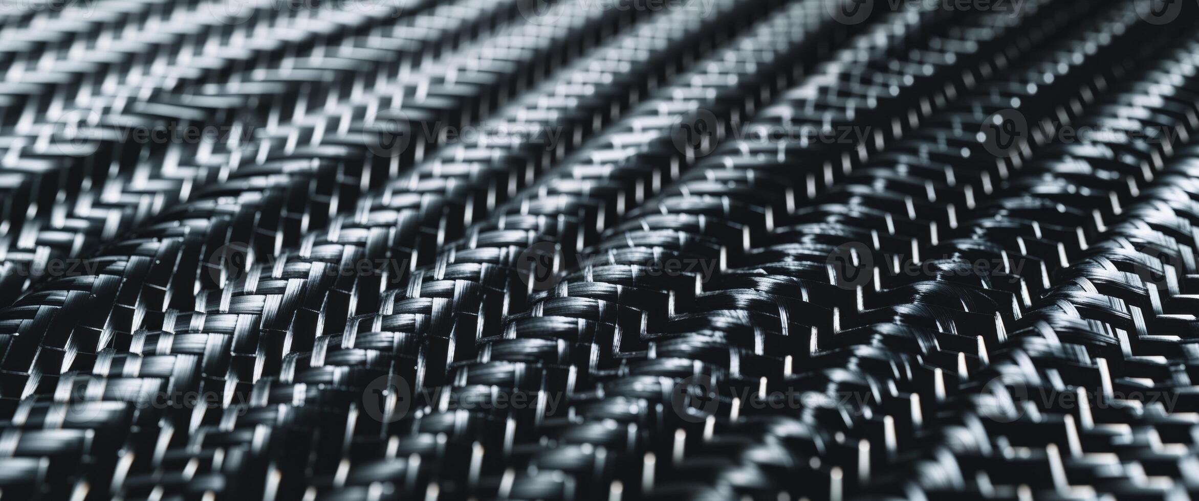 Modern woven carbon fiber texture background for design projects photo