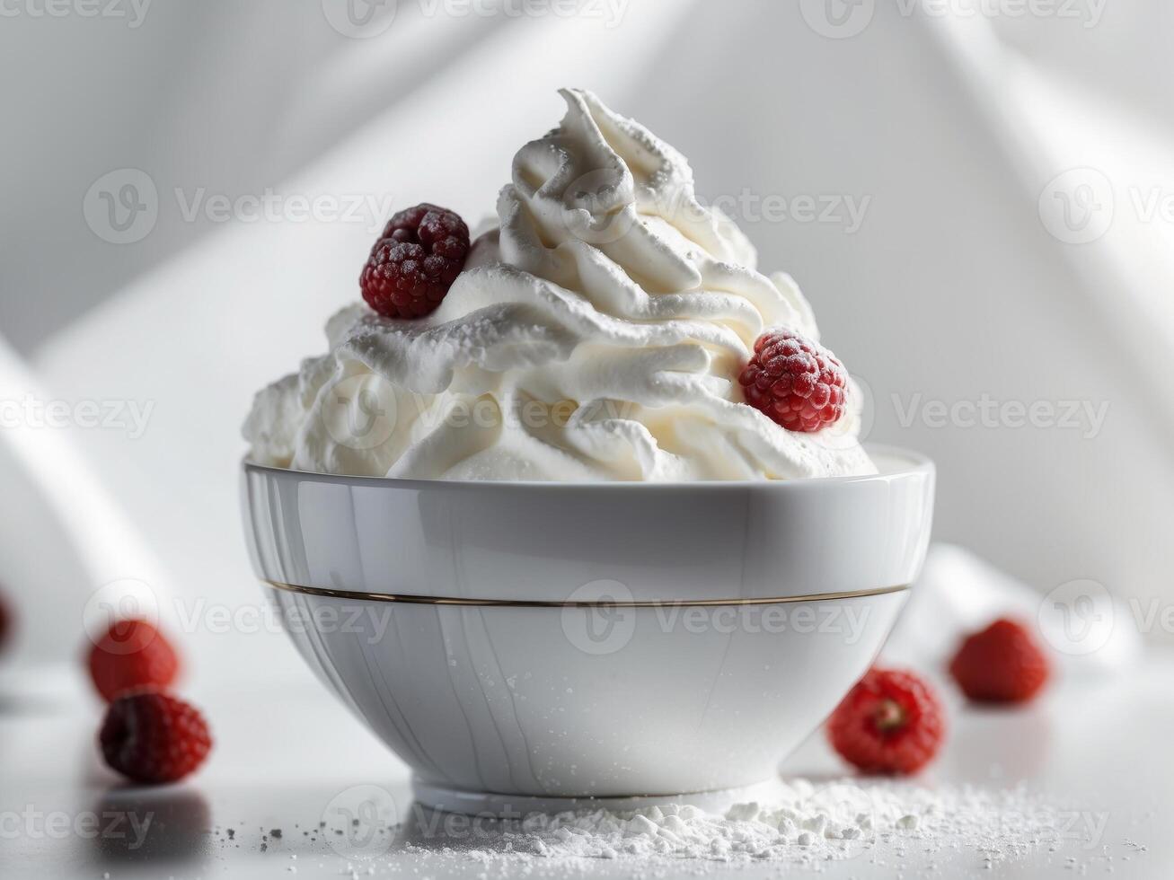 A bowl of whipped cream with raspberries on top photo