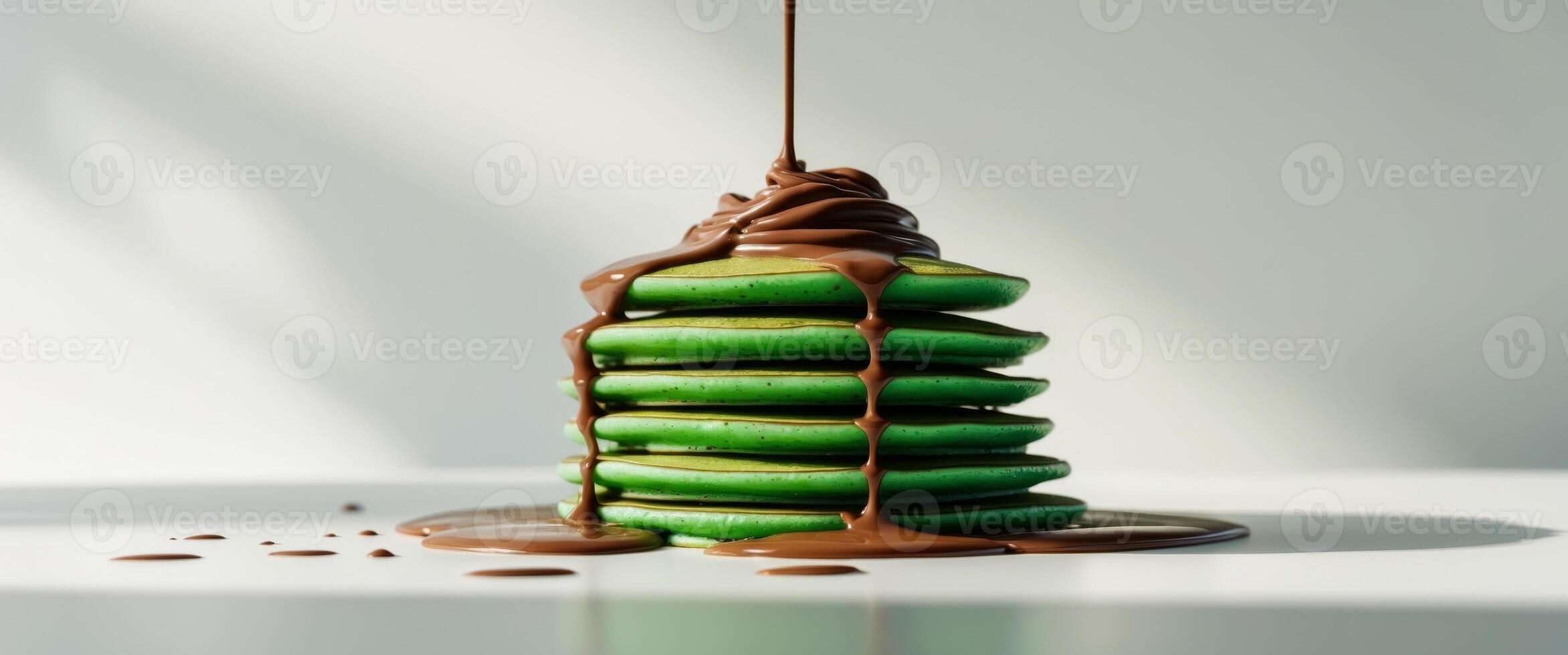 A stack of pancakes with chocolate drizzle on top photo