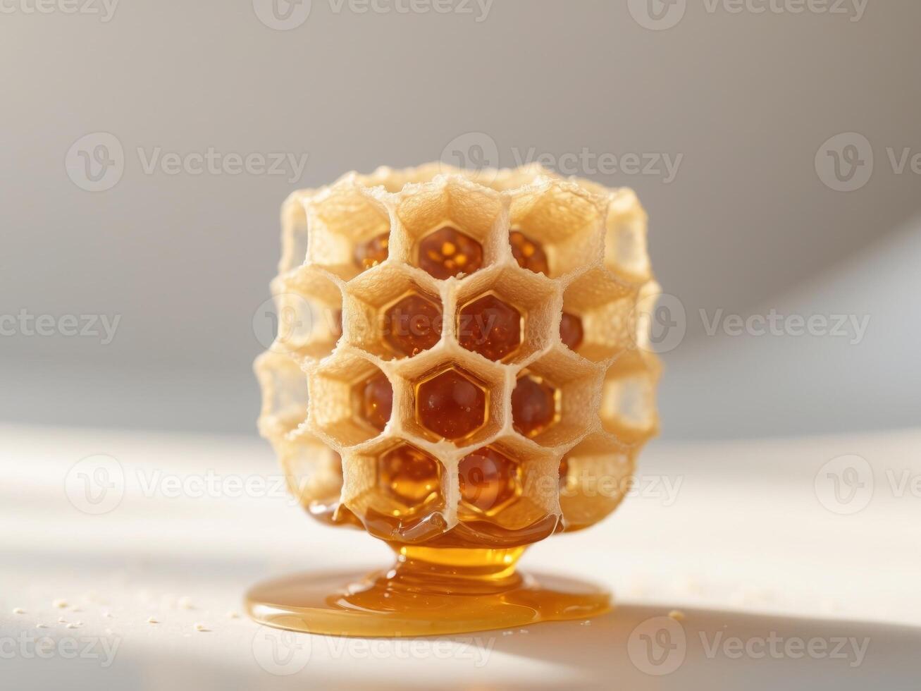 Examining Golden Honeycomb Structure with Liquid Honey for Culinary Uses photo