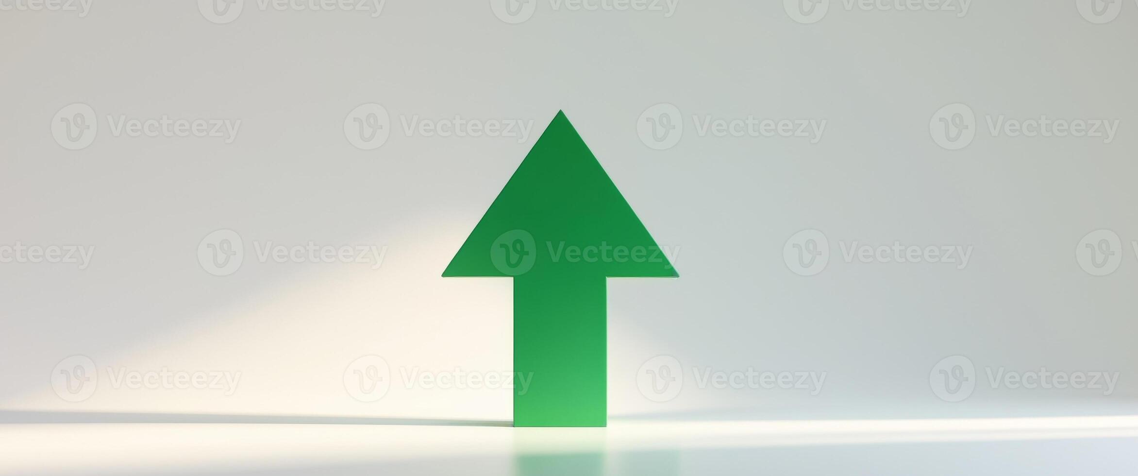 Green upward arrow pointing up representing growth and success photo