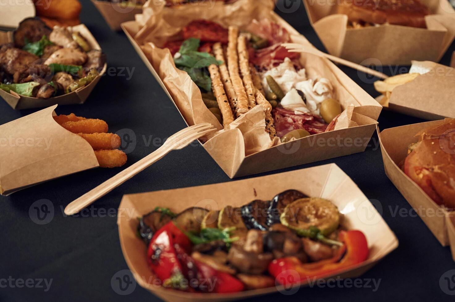 Top, view of, table with food, on it. Meat, vegetables, French fries, burger, mushrooms photo
